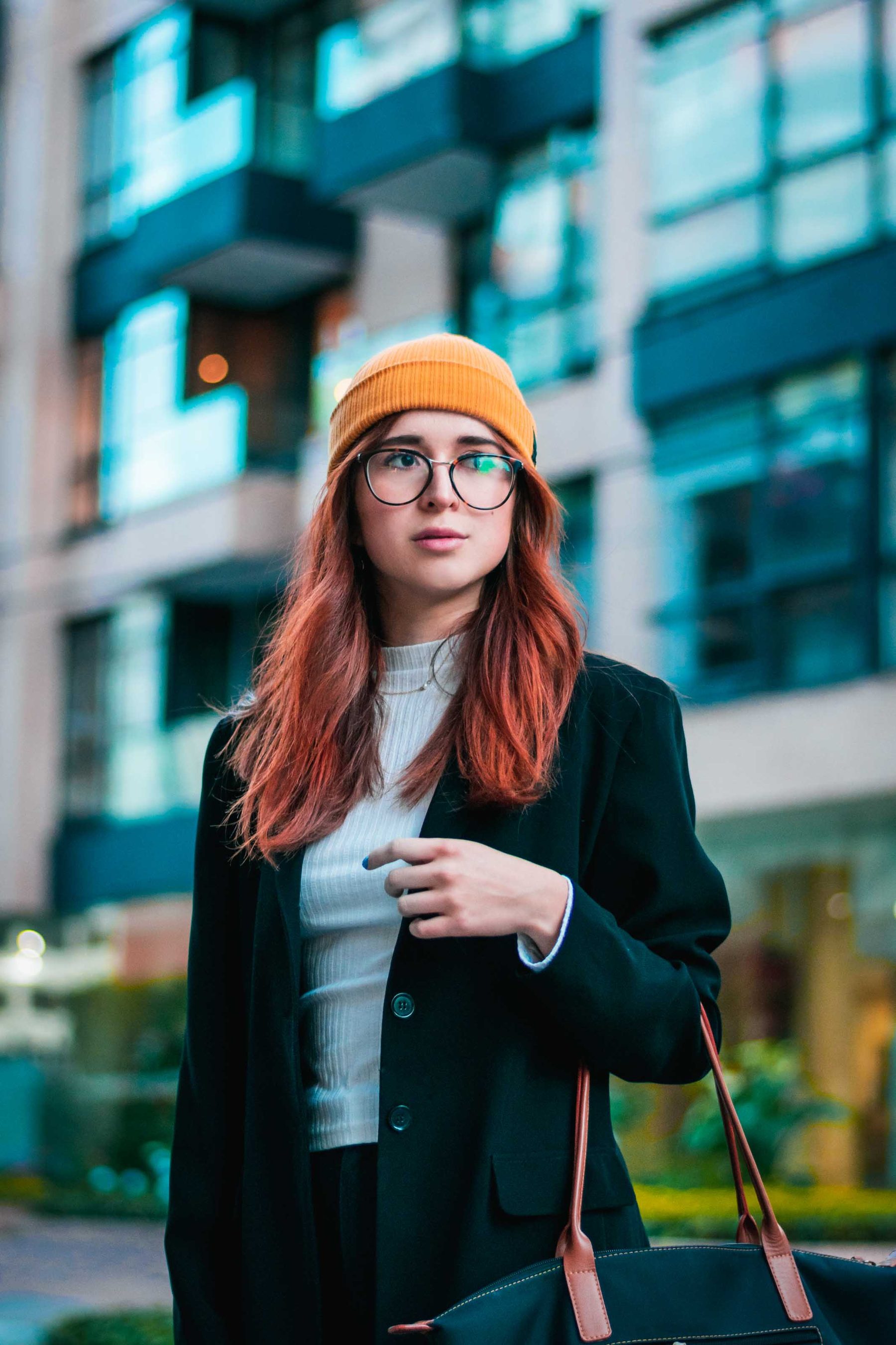 Portrait against glass towers