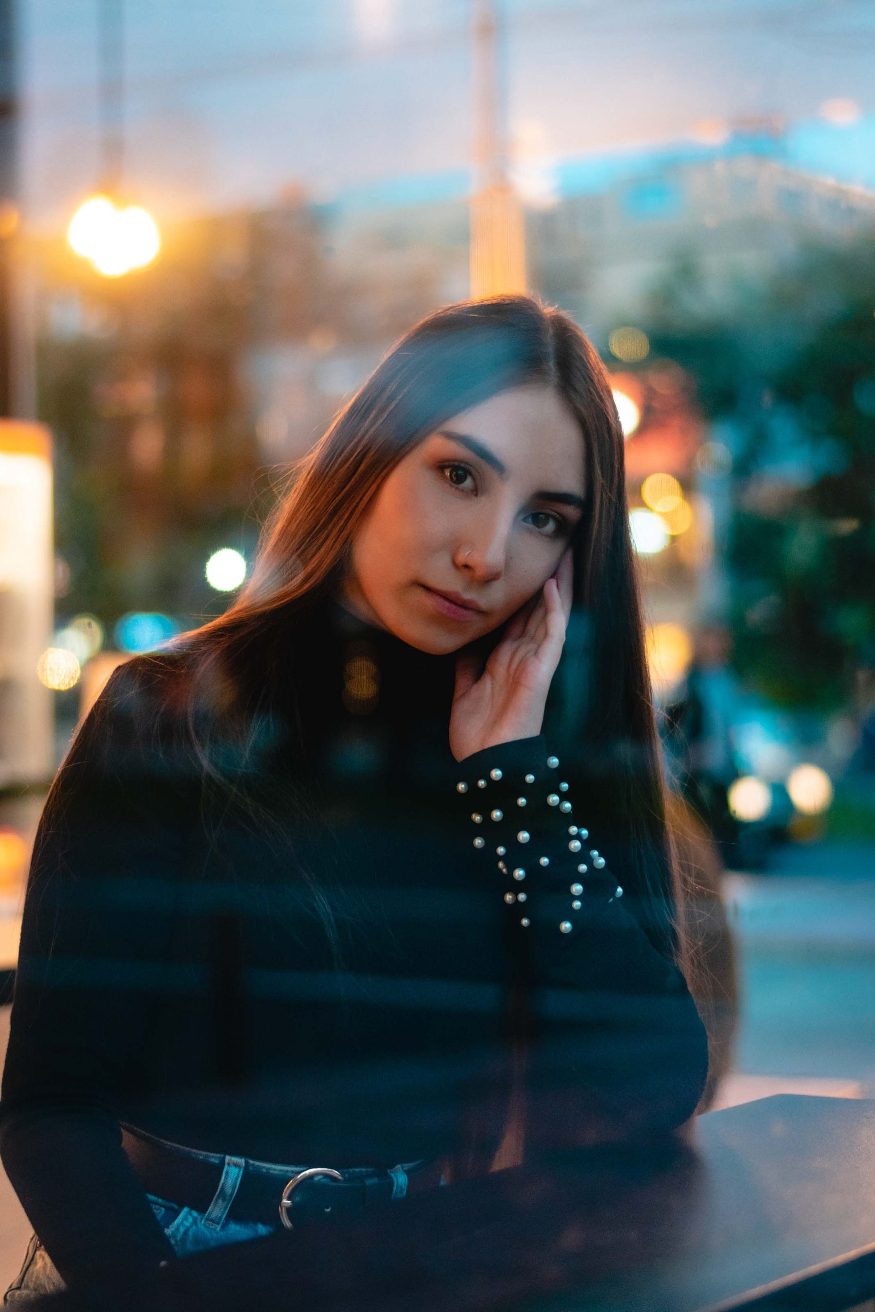 Portrait against city lights at night
