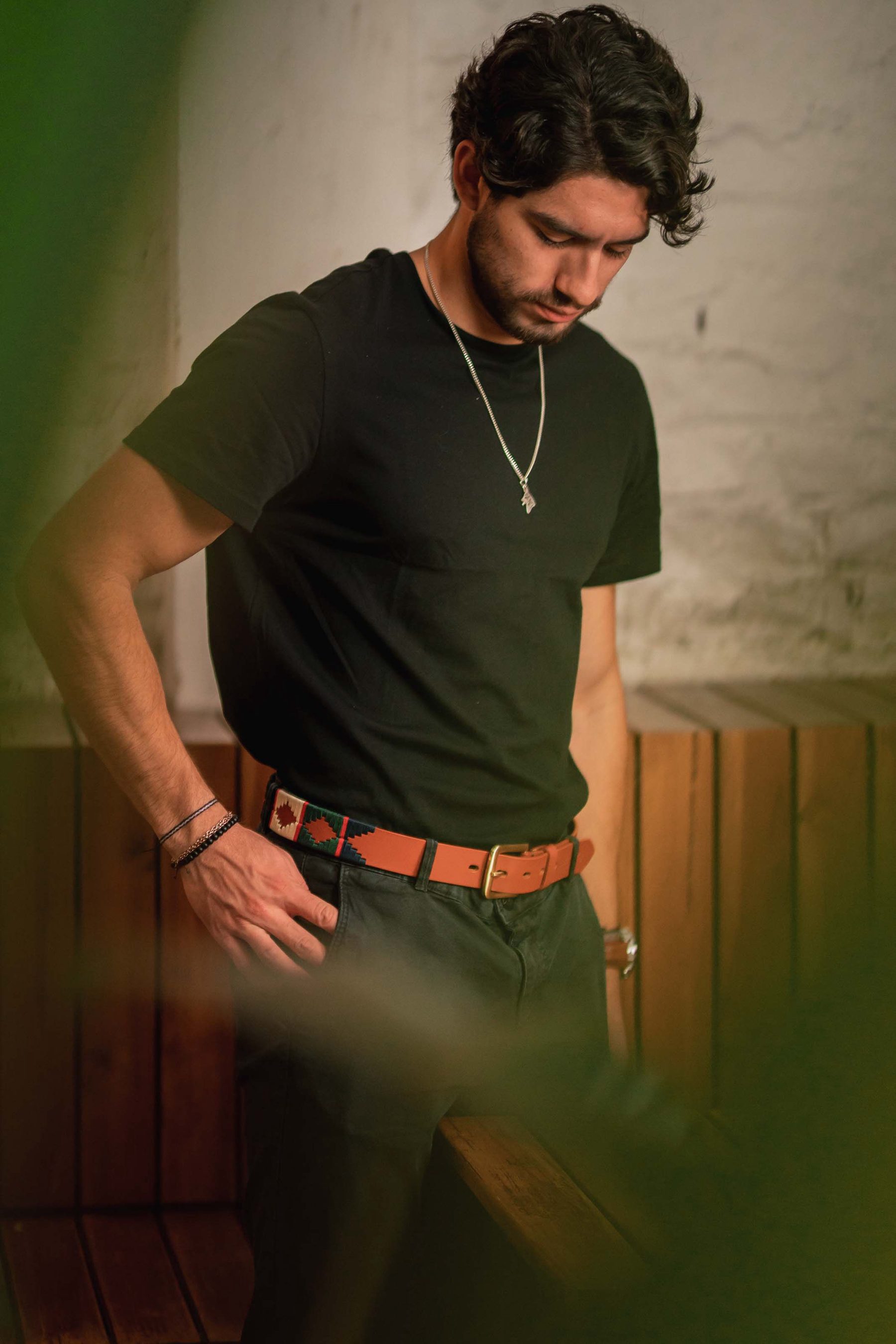 Man in a dark shirt against warm light