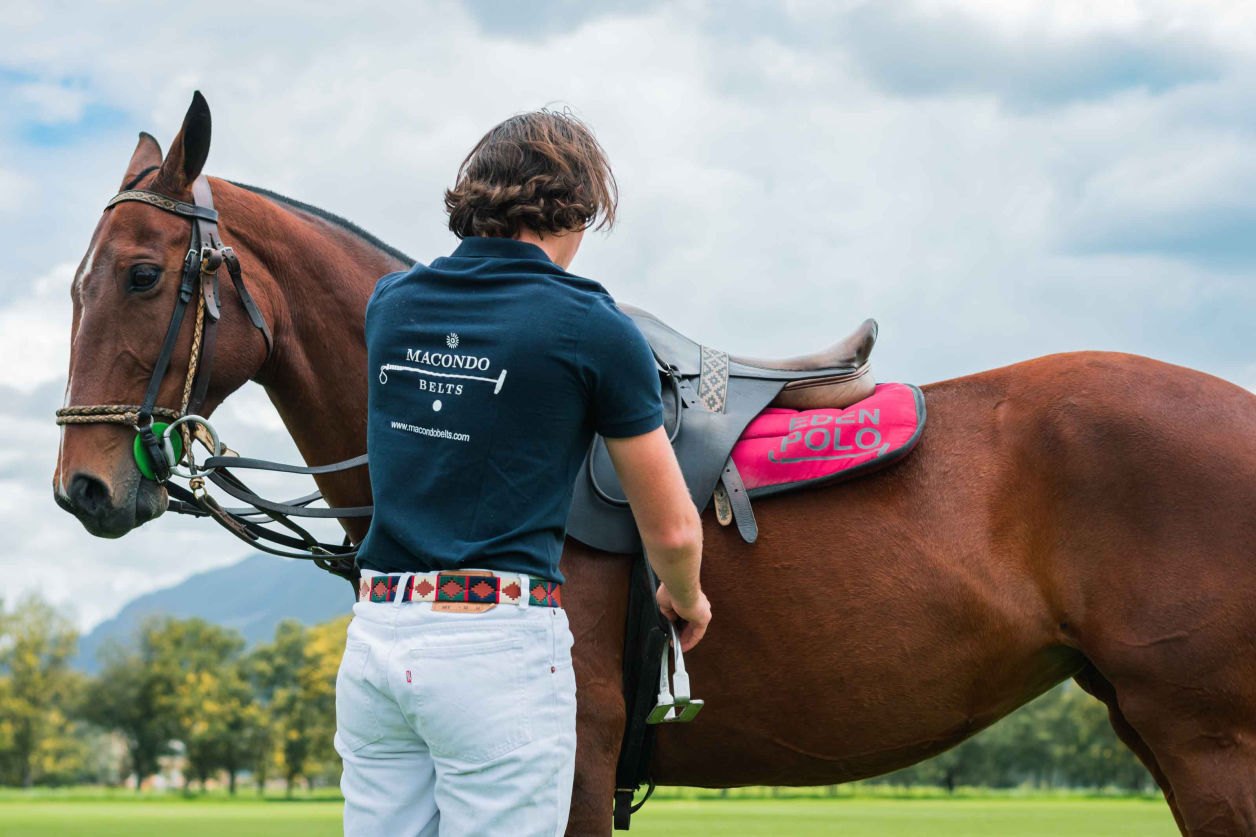 Rider beside his horse, belt in frame