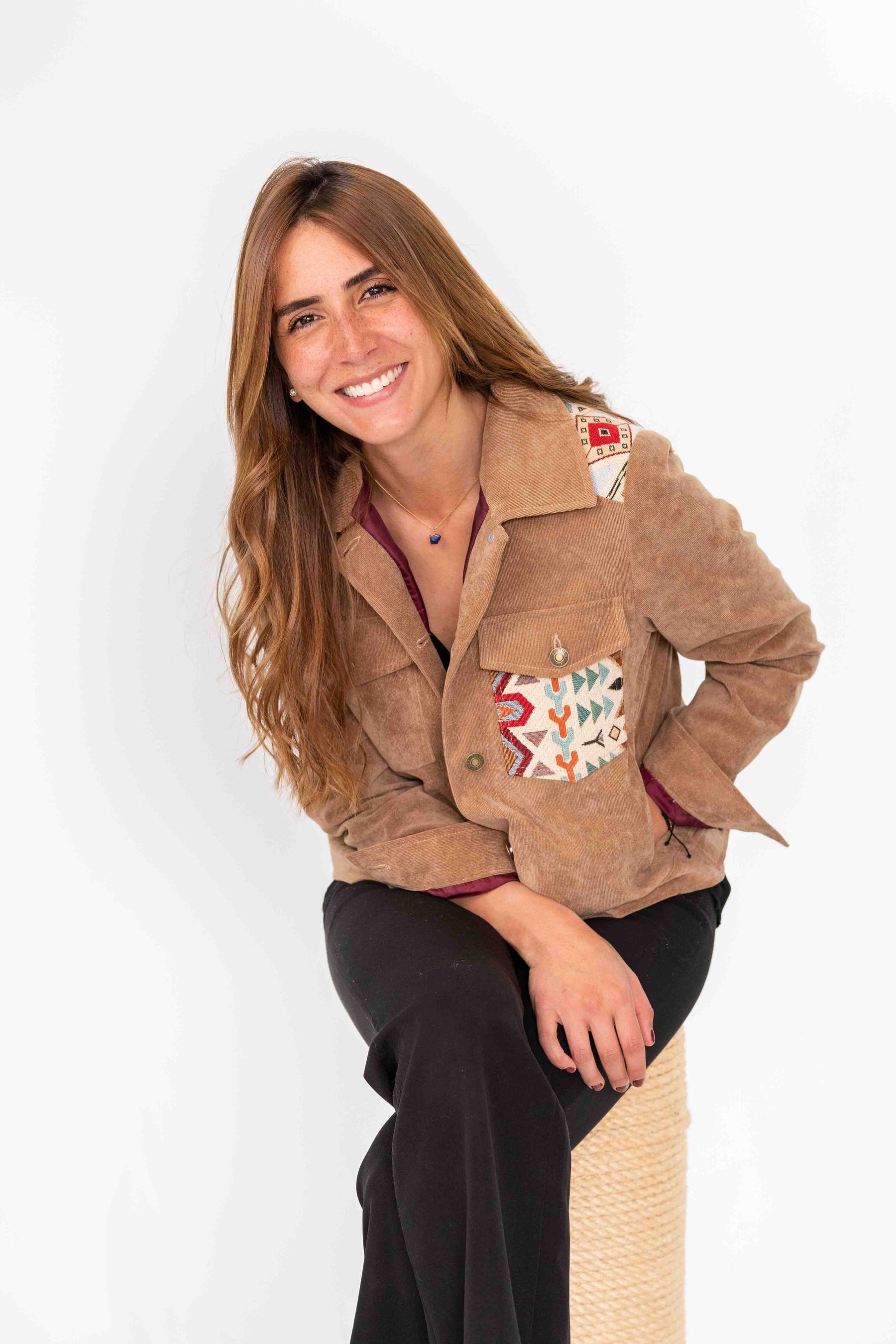 Model in an embroidered jacket