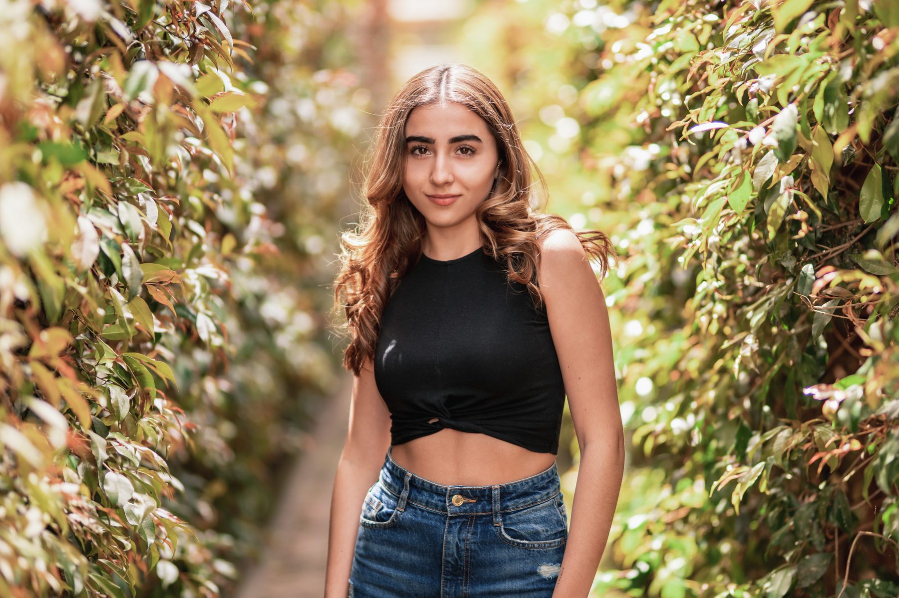 Model in black among flowers