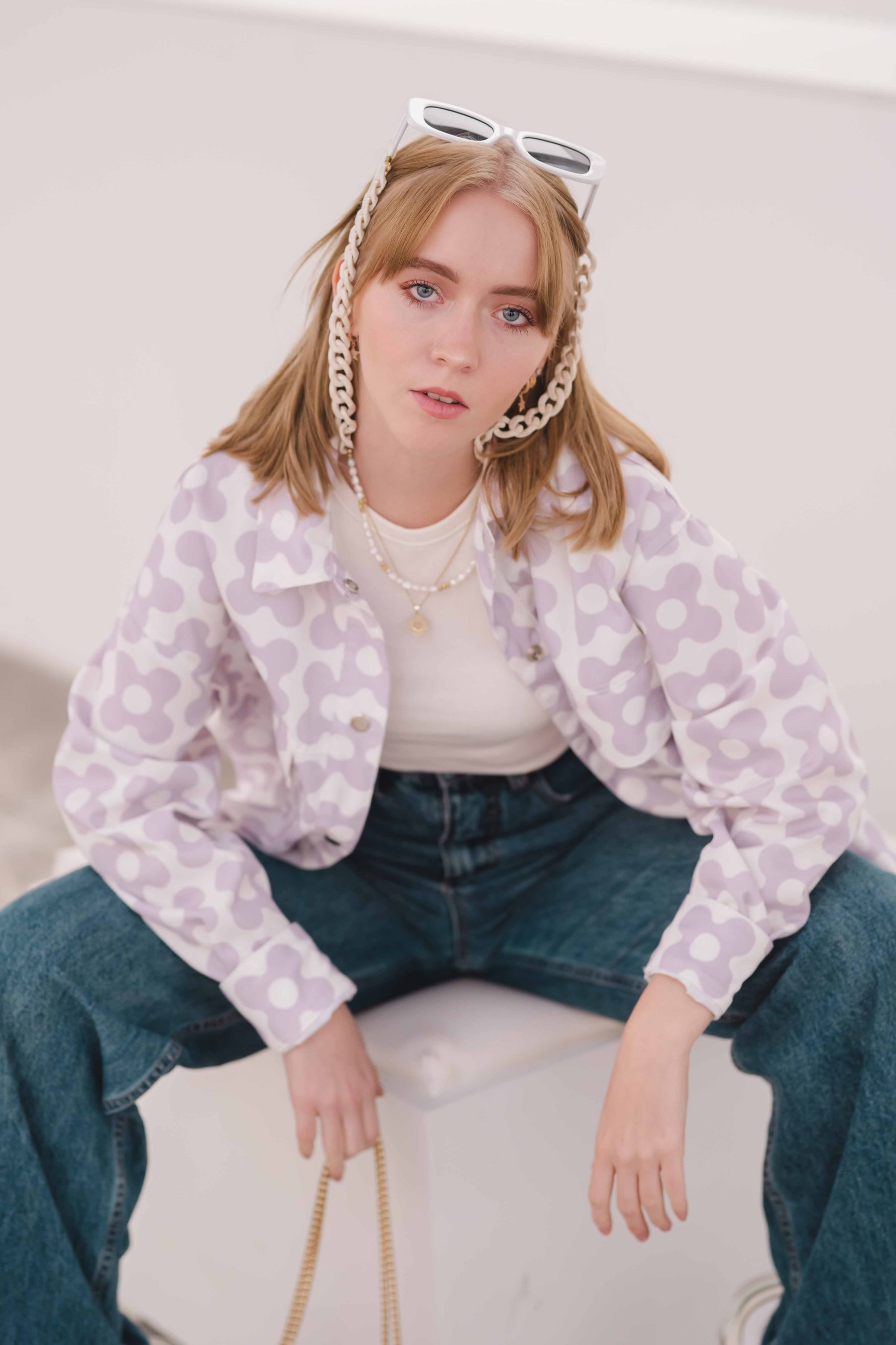 Model in a lilac printed blouse