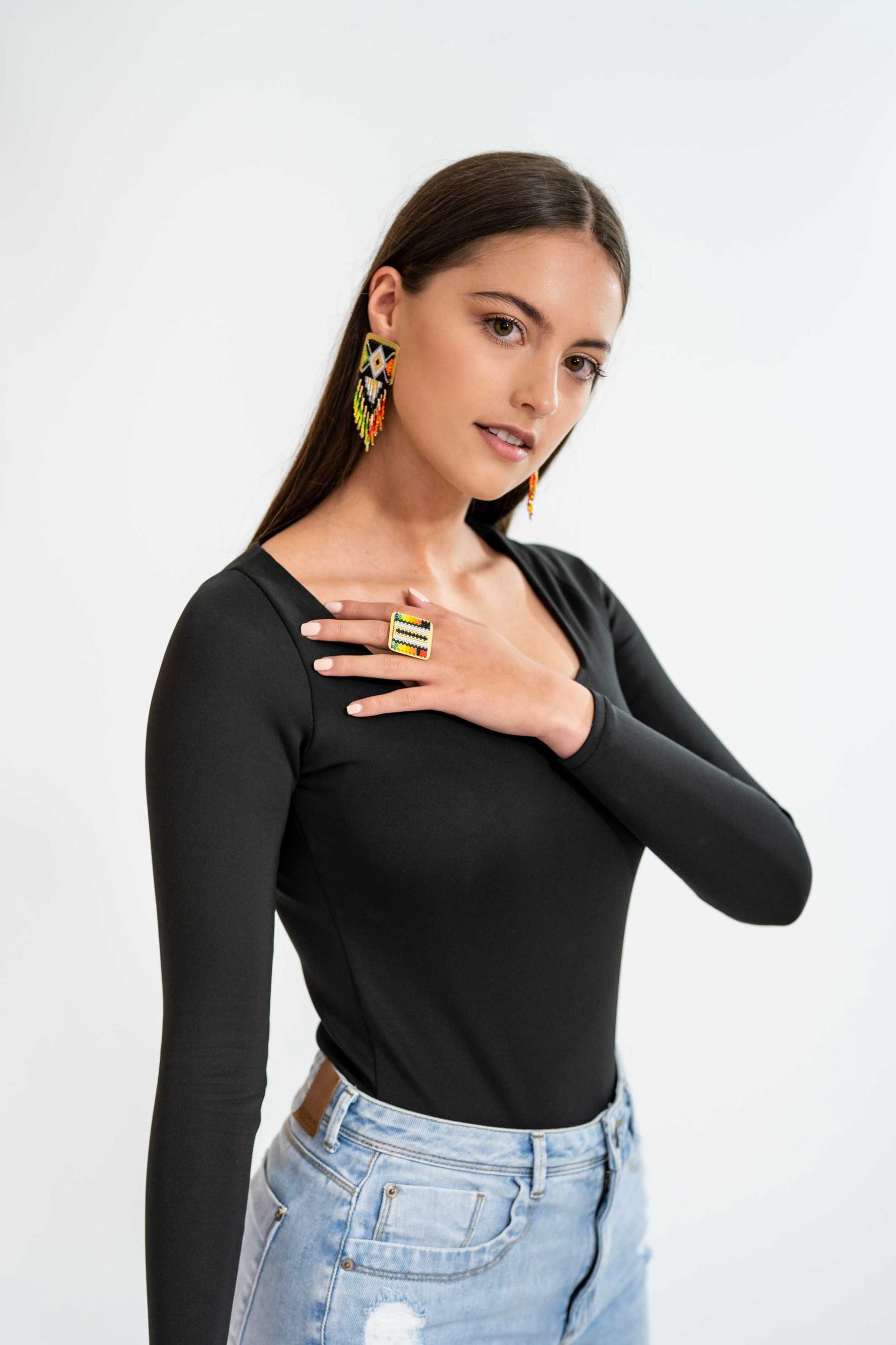 Model in black with a statement ring