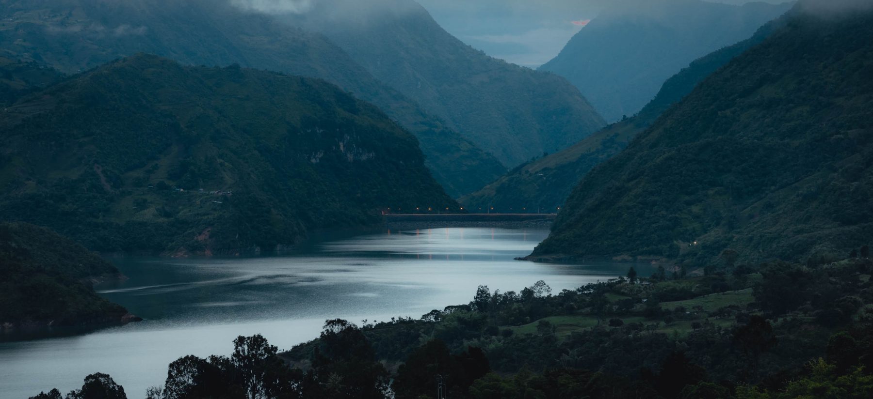 Dark lake between mountains