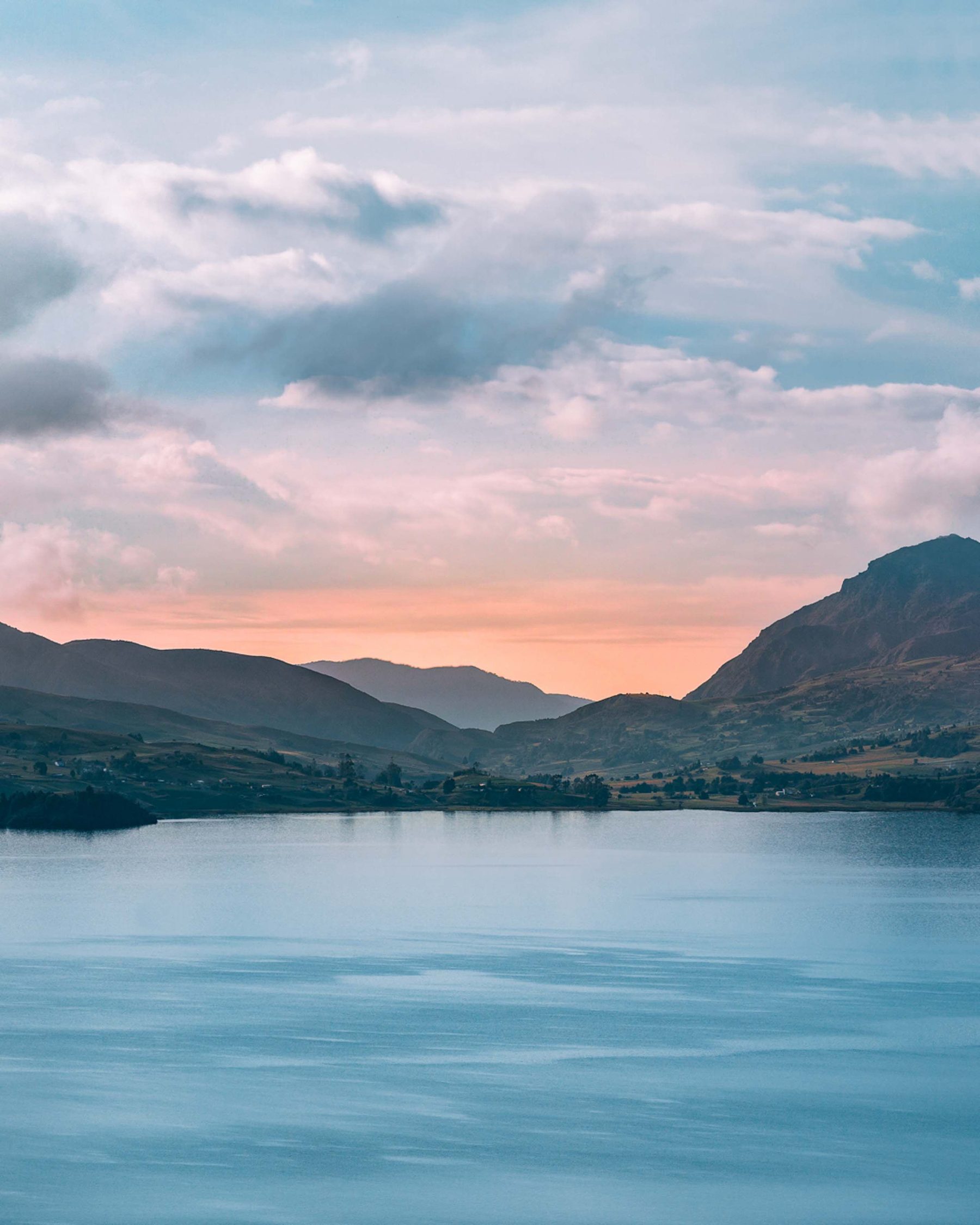Pink sunset over a highland lake