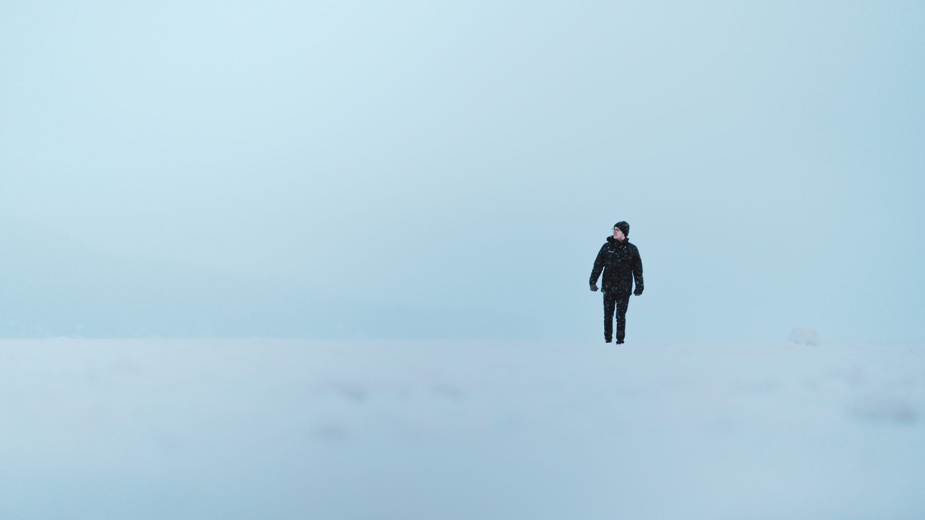A lone figure walking into the fog in San Francisco