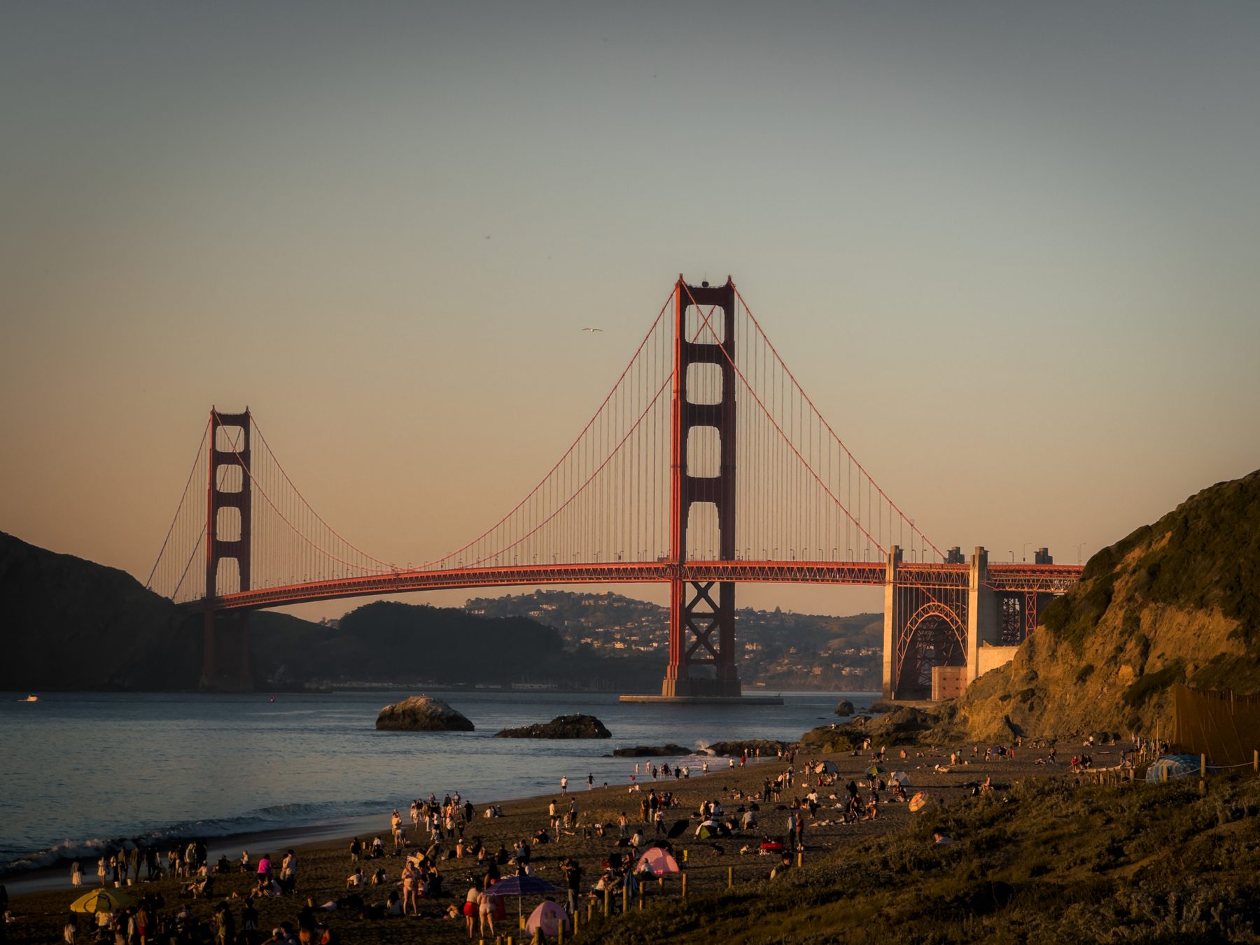Crowd watching the Golden Gate at sunset