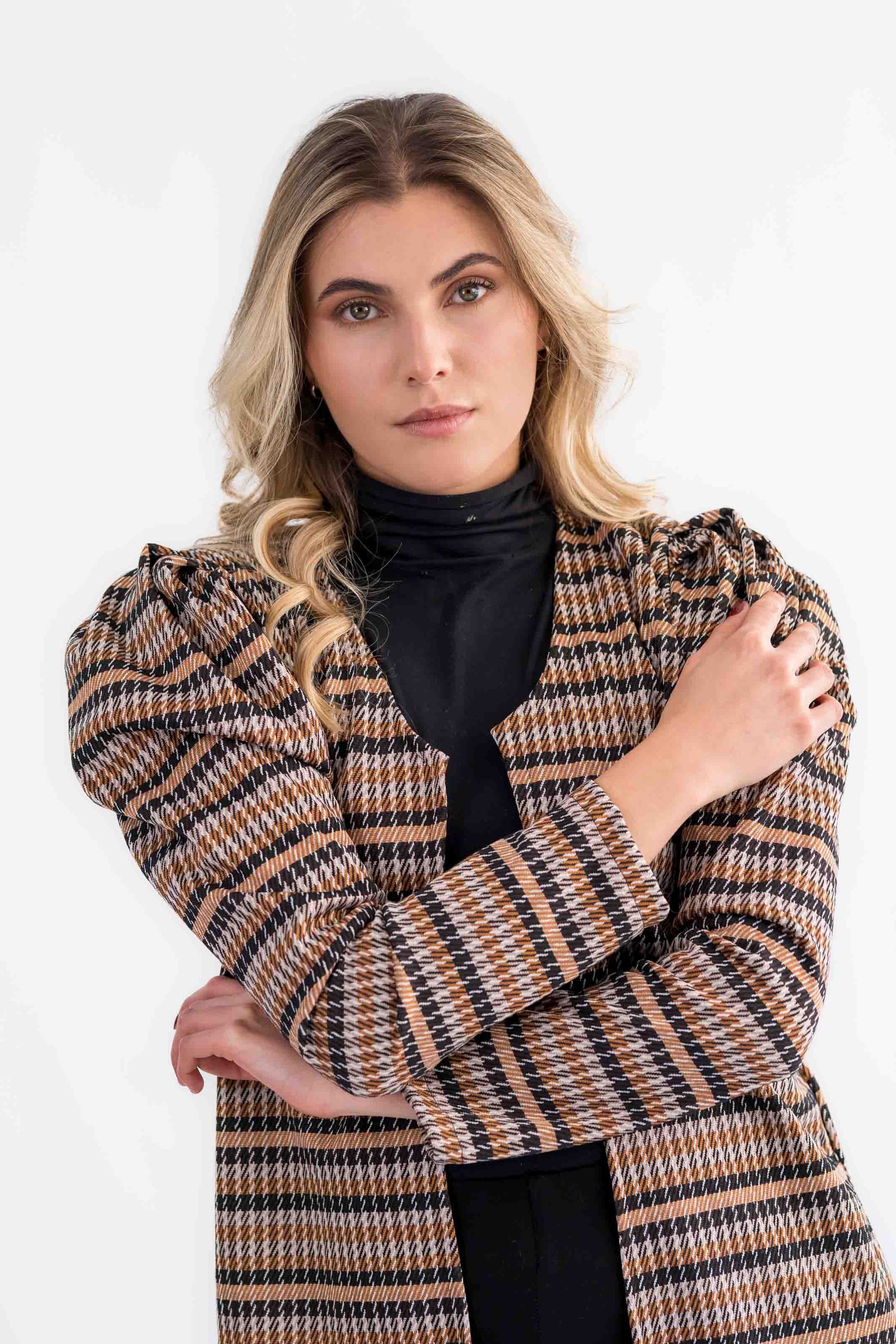 Model in plaid with puffed sleeves